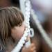 A youngster waits for the Les 7 Doigts to perform on Friday, June 21. Daniel Brenner I AnnArbor.com